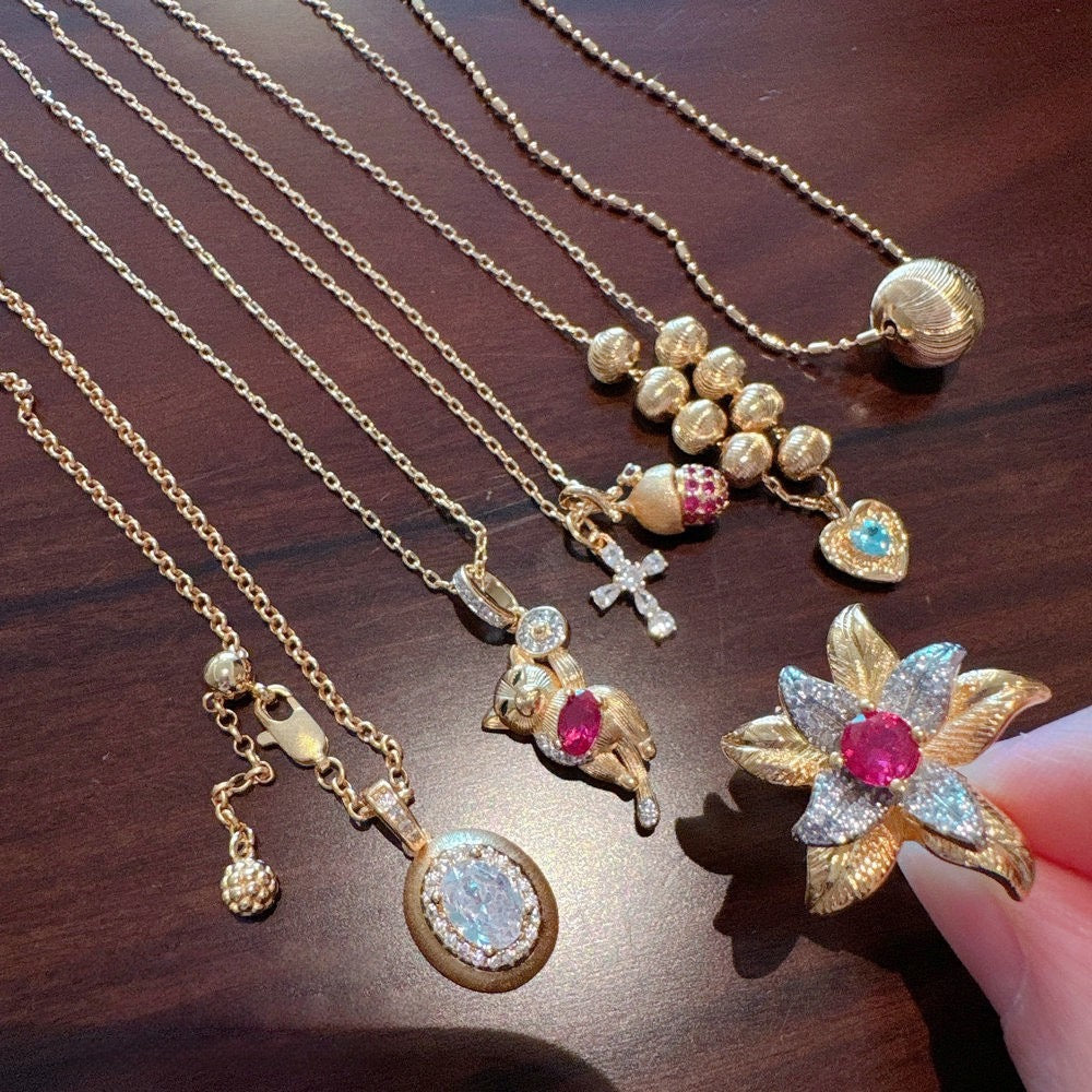 Vintage Italian brushed pine cone cross gemstone necklace, pigeon egg zircon necklace, layered and worn