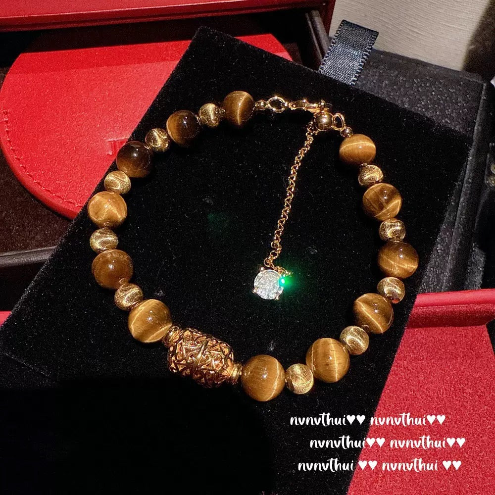 Ancient-style golden brushed ball-shaped tigereye stone bell crystal bracelet, new Chinese-style laurel rabbit saffron-yellow beeswax bracelet