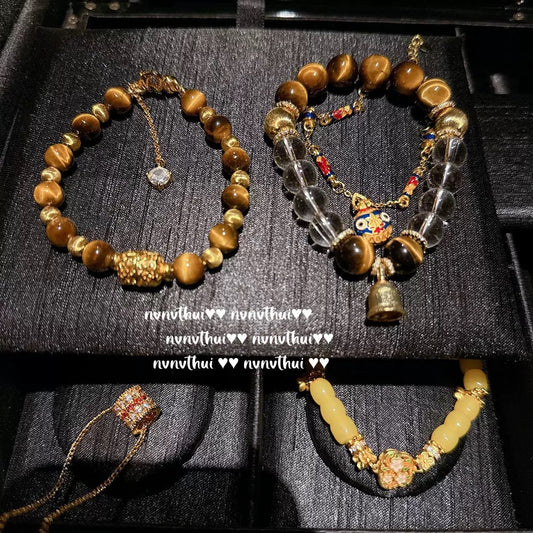 Ancient-style golden brushed ball-shaped tigereye stone bell crystal bracelet, new Chinese-style laurel rabbit saffron-yellow beeswax bracelet