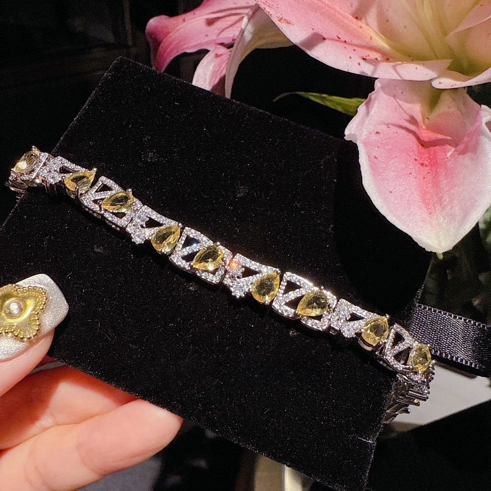 Yellow fluorite osmanthus honey daisy gemstone earrings plated with 18K gold irregular water droplet zircon bracelet