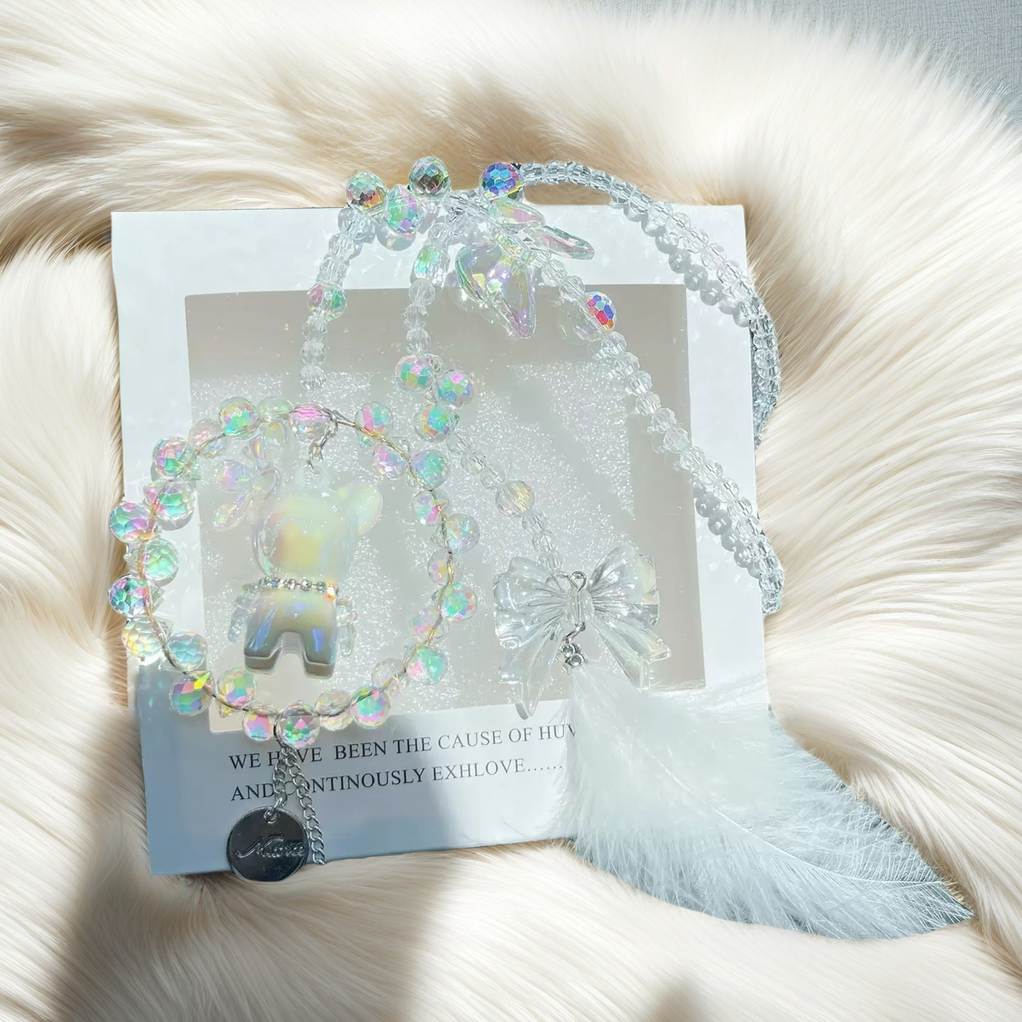 A cute car hanging decoration with a deer, a flower and feathers. It's a lovely rearview mirror car accessory for goddesses.